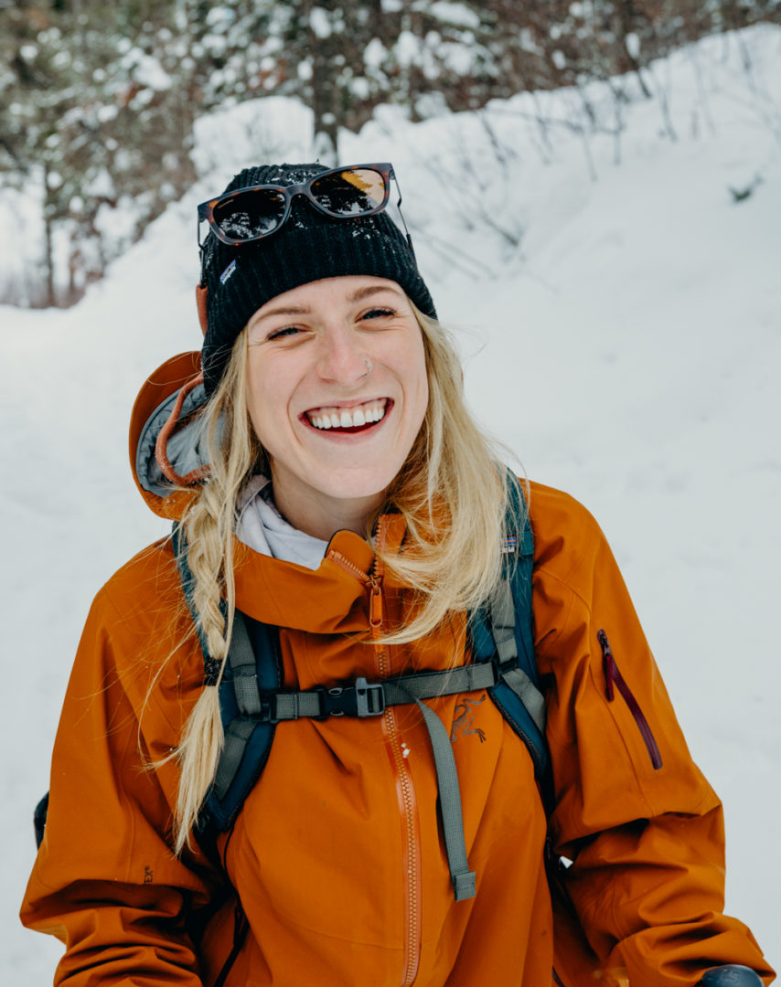 Woman smiling in backcountry ski clothing Erin Wheat